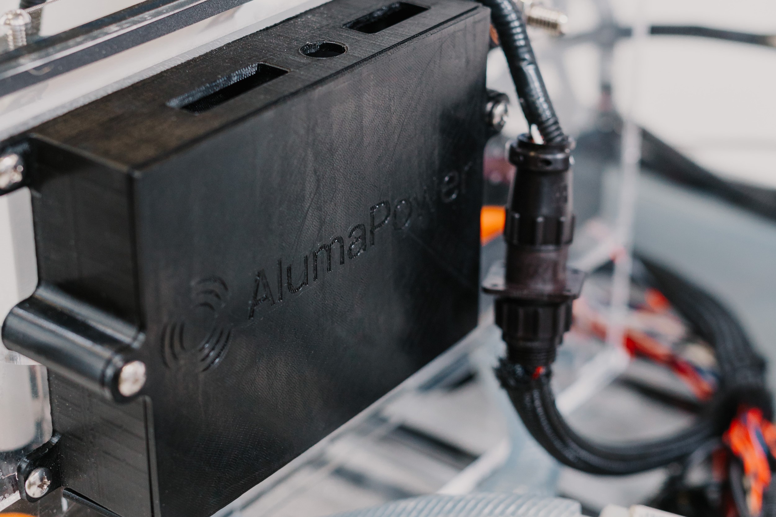 Close up of an engineering project with the AlumaPower logo